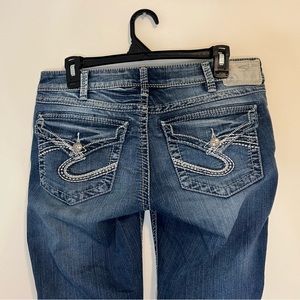 Low rise boot cut silver jeans